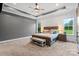 Spacious main bedroom features tray ceilings, large windows, and plush carpeting at 867 Bellegray Rd, Clover, SC 29710
