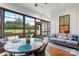 Bright sunroom featuring a seating area and large windows offering views of the outdoors at 867 Bellegray Rd, Clover, SC 29710