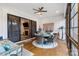Bright sunroom with a ceiling fan, access to the fireplace, and comfortable seating at 867 Bellegray Rd, Clover, SC 29710