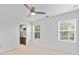 Spacious bedroom with a ceiling fan and an attached bathroom at 10027 Juniper Trace Dr, Charlotte, NC 28277