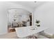Open-concept dining and kitchen area with modern furnishings and natural light at 10027 Juniper Trace Dr, Charlotte, NC 28277
