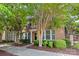 Attractive brick exterior of a two-story home with well-maintained landscaping and sidewalk at 10027 Juniper Trace Dr, Charlotte, NC 28277