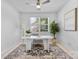 Bright home office with modern desk, rug, and decor, ideal for remote work at 10027 Juniper Trace Dr, Charlotte, NC 28277