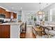 Eat-in kitchen connects dining room and kitchen with counter seating, great for entertaining at 10027 Juniper Trace Dr, Charlotte, NC 28277