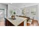 Open kitchen offers granite counters, a double sink, and a view into the dining area at 10027 Juniper Trace Dr, Charlotte, NC 28277