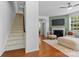 Inviting living room with a fireplace, plush seating, and hardwood floors at 10027 Juniper Trace Dr, Charlotte, NC 28277