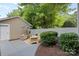 Outdoor patio area with seating, umbrella, and landscaping at 10027 Juniper Trace Dr, Charlotte, NC 28277