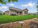 The house showcases a manicured backyard with stone details, perfect for outdoor entertaining at 1004 Fairbanks Ct, Indian Trail, NC 28079
