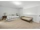 Spacious bedroom with neutral carpet, perfect for relaxing or entertaining guests with comfortable seating area at 1004 Fairbanks Ct, Indian Trail, NC 28079