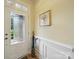 Bright foyer with decorative molding, wood-look floors, and a transom window above the door at 1004 Fairbanks Ct, Indian Trail, NC 28079