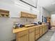 Spacious garage featuring a workbench area for projects and ample storage space for tools at 1004 Fairbanks Ct, Indian Trail, NC 28079