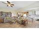 Open-concept living and dining area with comfortable sofa, bookshelf, and hardwood floors at 1004 Fairbanks Ct, Indian Trail, NC 28079