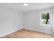 Bedroom with wood flooring, white walls, and natural light from the window at 101 Churchill Dr, Kings Mountain, NC 28086