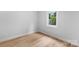 Bedroom features wood flooring and a window bringing in natural light at 101 Churchill Dr, Kings Mountain, NC 28086