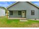 Exterior featuring a white front door, covered porch, and siding at 101 Churchill Dr, Kings Mountain, NC 28086