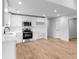 Well-lit kitchen features stainless steel appliances, white subway tile backsplash, and wood flooring at 101 Churchill Dr, Kings Mountain, NC 28086