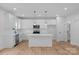 Clean, modern kitchen featuring white cabinetry, stainless steel appliances, and a functional center island at 103 Churchill Dr, Kings Mountain, NC 28086