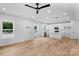 Bright, open-concept living area with sleek flooring, modern fixtures, and a kitchen island at 103 Churchill Dr, Kings Mountain, NC 28086