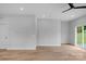 Bright, open-concept living area with modern ceiling fan and new wood-look floors at 103 Churchill Dr, Kings Mountain, NC 28086