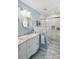 Bathroom featuring double sinks, sleek marble countertops and a glass-enclosed shower at 106 Phifer St, Fort Mill, SC 29715