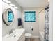 Bathroom featuring a vanity, window, and shower with a blue-themed curtain at 106 Phifer St, Fort Mill, SC 29715