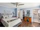 Bright bedroom featuring hardwood floors, a walk-in closet, and an ensuite bathroom at 106 Phifer St, Fort Mill, SC 29715