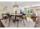 Dining room with stylish chandelier and seating, opens to a comfortable and bright living space at 106 Phifer St, Fort Mill, SC 29715