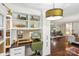 Dedicated workspace with custom shelving, a practical desk area, and views of the dining area at 106 Phifer St, Fort Mill, SC 29715