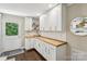 Stylish kitchen with wooden countertops, white cabinets, and open shelving for a modern and functional design at 106 Phifer St, Fort Mill, SC 29715