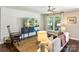 Cozy living room with stylish decor, including a shiplap accent wall, modern furniture, and natural light at 106 Phifer St, Fort Mill, SC 29715