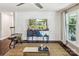 Inviting living room with shiplap accent wall, decorative console, and natural light from the adjacent window at 106 Phifer St, Fort Mill, SC 29715