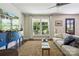 Bright living room featuring large window, ceiling fan, and area rug, offering a relaxing living space at 106 Phifer St, Fort Mill, SC 29715