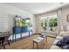Charming living room featuring shiplap wall, large window, and an area rug, creating a cozy and inviting atmosphere at 106 Phifer St, Fort Mill, SC 29715