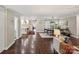 Open-concept living space with hardwood floors, stylish decor, and seamless flow to the kitchen at 106 Phifer St, Fort Mill, SC 29715