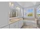 Relaxing bathroom featuring a double sink vanity, soaking tub, and separate glass-enclosed shower at 1070 Blueberry Rd, Salisbury, NC 28147