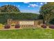 Stone sign for Davis Farm community, showcasing manicured landscaping and mature trees at 1070 Blueberry Rd, Salisbury, NC 28147