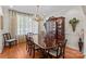 Elegant dining room with hardwood floors and a large china cabinet at 1070 Blueberry Rd, Salisbury, NC 28147