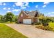 Charming brick home featuring an attached two car garage, manicured landscaping and a spacious driveway at 1070 Blueberry Rd, Salisbury, NC 28147