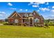 Charming, two-story brick home featuring a well-manicured lawn and inviting front porch at 1070 Blueberry Rd, Salisbury, NC 28147