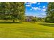Beautiful two-story home with lush lawn, mature trees, and well-maintained landscaping at 1070 Blueberry Rd, Salisbury, NC 28147