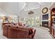 Cozy living room featuring a fireplace, vaulted ceilings, and French doors to the backyard at 1070 Blueberry Rd, Salisbury, NC 28147