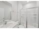 Clean bathroom with a glass-enclosed shower, white vanity, and toilet at 11131 Cardinal Creek Ave, Charlotte, NC 28215