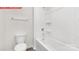 Full bathroom featuring a tub-shower combo with white tiling and a low-flow toilet at 11131 Cardinal Creek Ave, Charlotte, NC 28215
