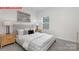 Comfortable bedroom with neutral tones, soft lighting, and a cozy bed perfect for relaxation at 11131 Cardinal Creek Ave, Charlotte, NC 28215