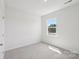 Neutral bedroom with light carpet and a window providing natural light at 11131 Cardinal Creek Ave, Charlotte, NC 28215