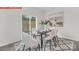 Dining area features modern table with seating and sliding glass doors offering natural light at 11131 Cardinal Creek Ave, Charlotte, NC 28215