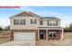 Charming two-story home featuring a brick-accented facade, attached garage, and covered front porch at 11131 Cardinal Creek Ave, Charlotte, NC 28215
