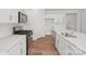 Well-lit kitchen featuring stainless steel appliances, wood floors, and white subway tile backsplash at 11131 Cardinal Creek Ave, Charlotte, NC 28215