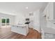 Modern kitchen with a center island, stainless steel appliances, and sleek white cabinetry at 11131 Cardinal Creek Ave, Charlotte, NC 28215