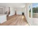 Living room featuring wood flooring, fireplace, staircase, and sliding glass doors at 11131 Cardinal Creek Ave, Charlotte, NC 28215